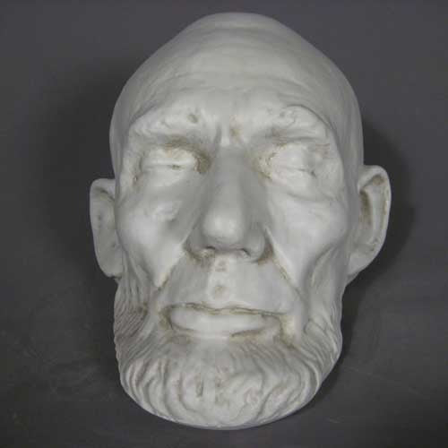 Classical old world European sculpted head with closed eyes, detailed facial features, and a prominent beard in Renaissance style. Additional Angle