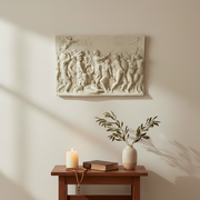 Classical bas-relief wall panel depicting a lively Renaissance scene with figures in flowing robes, ornate details, and mythological motifs. Side Angle