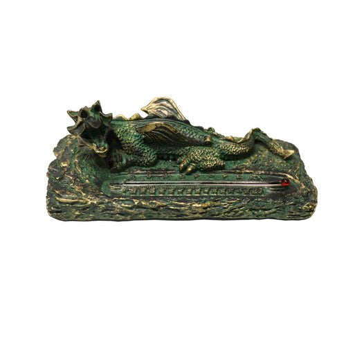 Dragon figurine in medieval Gothic style resting on a textured base with an ornate thermometer embedded in front. Side View