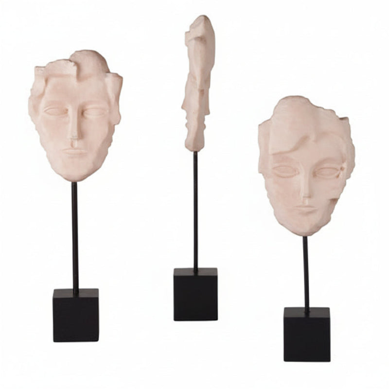 Fragmented classical face sculptures on black stands, featuring old world European and Renaissance-inspired ornate detailing.
