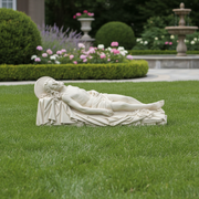 Reclining Christ sculpture in classical Renaissance style, featuring ornate drapery and serene facial expression. Side Angle