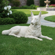 Reclining German Shepherd statue with classical, old world European detailing and ornate fur texture in a lifelike, regal pose. Side Angle