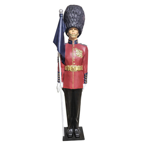 British royal guard statue in ornate old world European style uniform, tall bearskin hat, holding a flag, classical military theme Side View