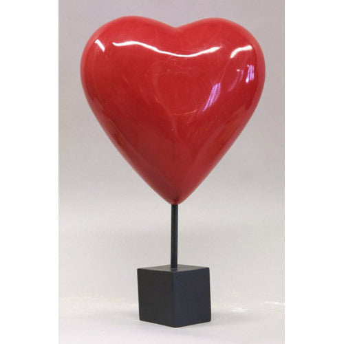Heart-shaped sculpture on a square pedestal stand, featuring smooth, minimalist lines with a classical European influence. Side Angle