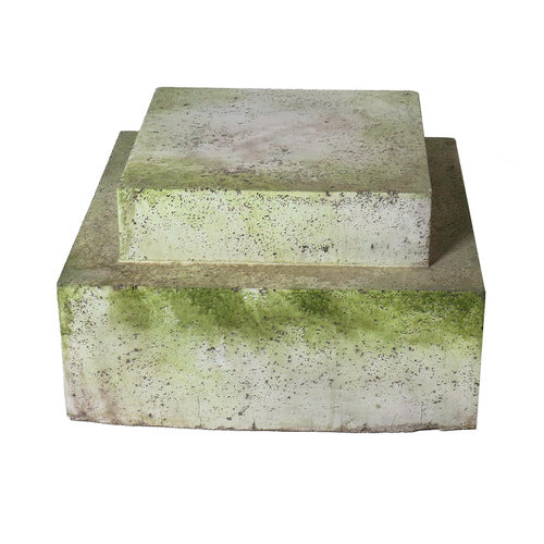 Stacked square pedestals with weathered, old world European style and ornate, classical detailing, featuring a mossy aged finish. Side View
