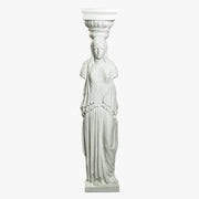 Caryatid column statue with classical Greek drapery and ornate Corinthian capital in old world European style Side View