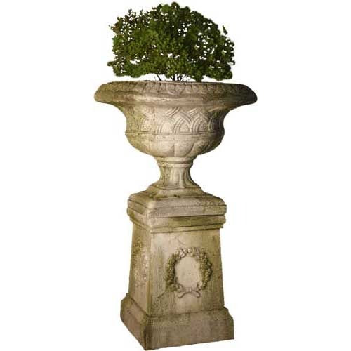 Ornate old world European urn planter with classical detailing and pedestal base, featuring intricate relief and laurel wreath motif.