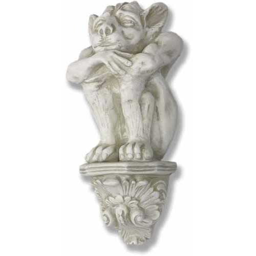 Grotesque gargoyle wall decor perched on ornate classical corbel, featuring old world European Gothic architectural details.