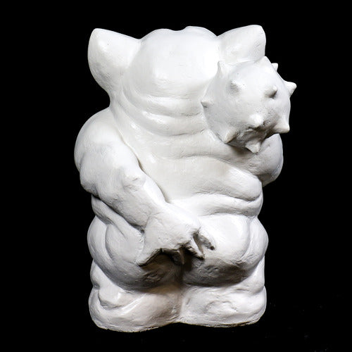 Grotesque gargoyle statue with exaggerated features, large ears, and a mischievous expression in old world European style. Side Angle