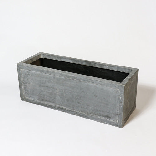 Rectangular planter box with clean lines and subtle classical detailing, evoking an old world European architectural style. Side View