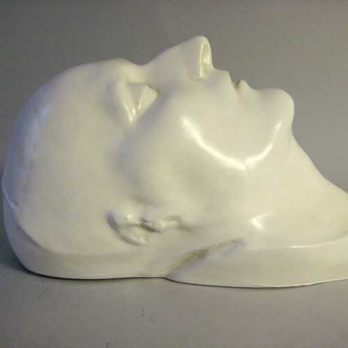 Classical European sculpted head with closed eyes, smooth features, and serene expression, evoking Renaissance and old world style. Other Angle