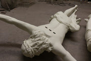 Crucifix statue featuring Jesus with outstretched arms, detailed drapery, and classical Renaissance-inspired sculptural style. Side Angle View