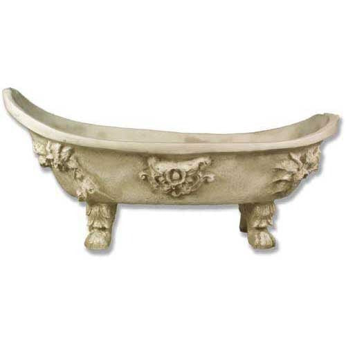 Ornate old world European clawfoot bathtub with classical Baroque floral reliefs and sculpted lion paw feet.