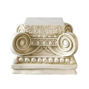 Classical Greek Ionic column capital with ornate volutes, egg-and-dart detailing, and sculpted acanthus leaf accents. Side View