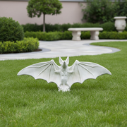 Bat wall sculpture with outstretched wings, featuring ornate Gothic and medieval detailing in an old world European style. Side Angle