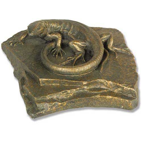 Lizard sculpture resting on a textured, layered stone base with ornate, old world European detailing and classical styling.