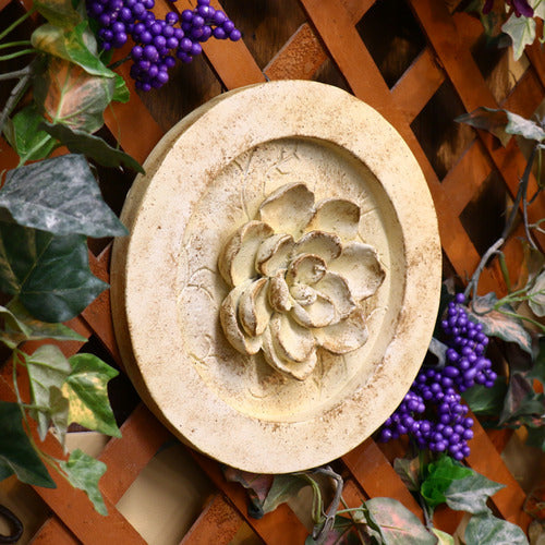 Ornate round medallion with raised floral motif, featuring classical old world European and Renaissance-inspired detailing. Different Angle