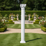 Corinthian column with fluted shaft and ornate acanthus leaf capital in classical Greek architectural style. Side Angle