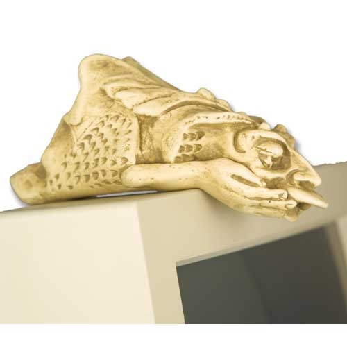 Grotesque face wall decor in old world European style, featuring a crouching gargoyle with ornate detailing and medieval Gothic theme.