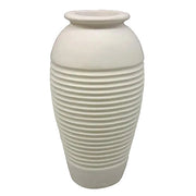 Classical urn with ribbed detailing and a rounded lip, inspired by old world European and Greek architectural styles.