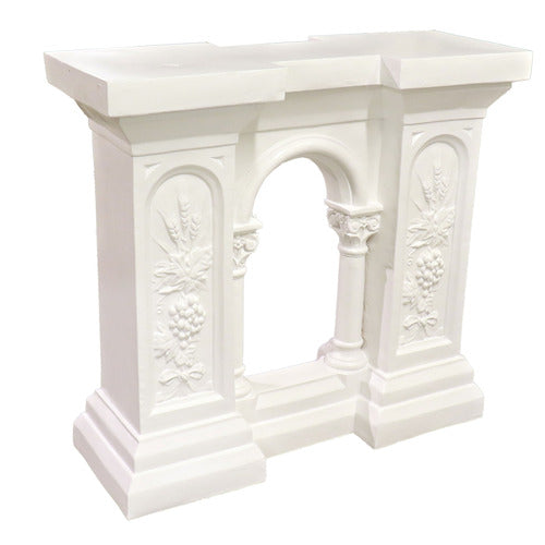 Classical console table with ornate floral reliefs, arched center opening, and column details in old world European style Side View