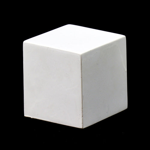 White geometric cube with smooth, clean edges and minimalist, classical design set against a solid black background.