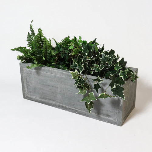 Rectangular planter box with clean lines and subtle classical detailing, evoking an old world European architectural style. Different Angle