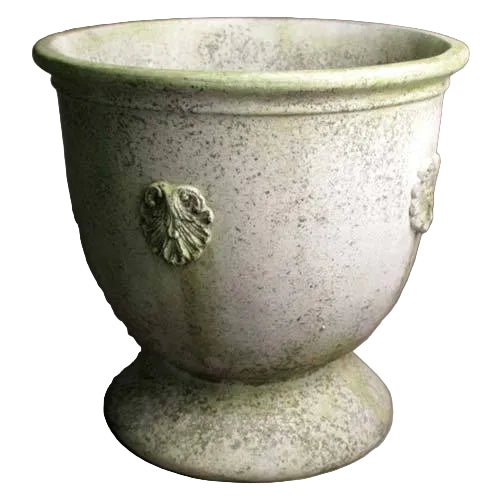 Ornate old world European urn planter with classical shell motifs and weathered, antique finish on a rounded pedestal base.