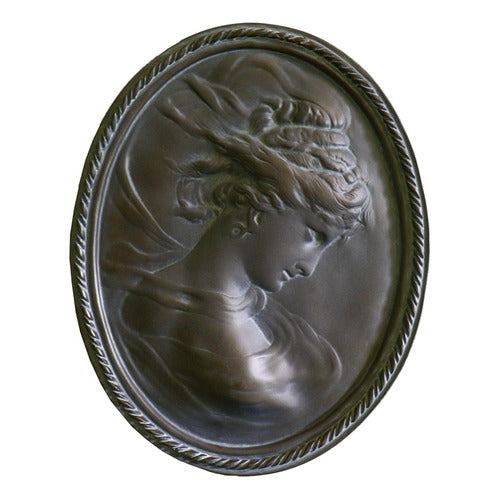 Classical oval wall plaque featuring a Baroque-style female profile with flowing hair and ornate detailing in relief.