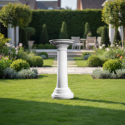 Classical Greek pedestal with fluted column design and ornate base, featuring old world European architectural style. Side Angle