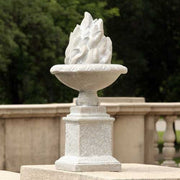 Ornate classical pedestal urn with sculpted flame motif, featuring old world European and Renaissance-inspired detailing. Side Angle