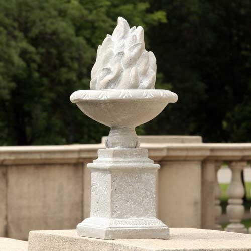 Ornate classical pedestal urn with sculpted flame motif, featuring old world European and Renaissance-inspired detailing. Side Angle