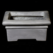 Rectangular planter with wide rim and stepped base, featuring classical old world European architectural lines and understated ornate detailing. Different Angle