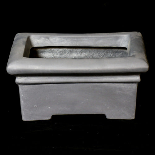 Rectangular planter with wide rim and stepped base, featuring classical old world European architectural lines and understated ornate detailing. Different Angle
