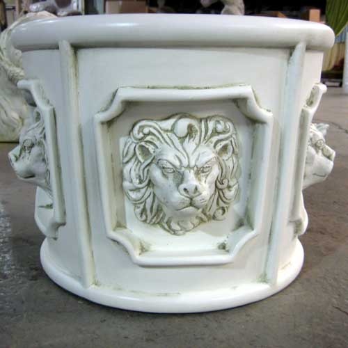 Ornate old world European planter with classical lion head reliefs in Baroque style panels and decorative architectural detailing. Side Angle