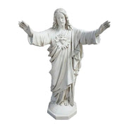 Jesus statue with outstretched arms, classical Renaissance style, ornate detailing, flowing robes, sacred heart motif on chest. Side View