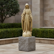 Madonna statue in classical Renaissance style with flowing drapery, serene expression, and outstretched hands on ornate pedestal. Different Angle