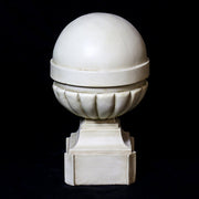 Ornate old world European finials with classical rounded tops and fluted bases on square pedestals in three graduated sizes. Different Angle