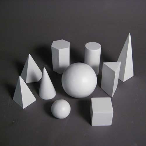 Geometric forms arranged in a group, featuring spheres, cubes, cones, pyramids, and cylinders in a classical study composition. Side Angle View