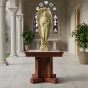 Angel statue with folded hands, long flowing robes, and large wings in an ornate, old world European classical style. Side Angle