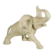 Elephant figurine with raised trunk, detailed fur texture, and classical old world European sculptural style.