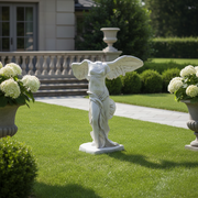 Winged classical Greek statue with draped robes, inspired by old world European and Hellenistic art, featuring ornate detailing. Side Angle