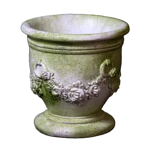 Ornate old world European planter with classical floral garland relief and Baroque-inspired decorative handles.