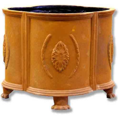 Ornate old world European planter with classical relief medallions, fluted panels, and paw feet in a Renaissance-inspired design.