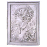 Classical bas-relief portrait of a woman in ornate Victorian attire with elaborate jewelry, framed in an old world European style.