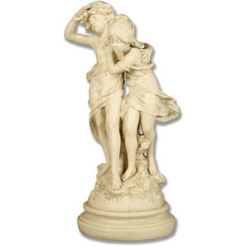 Classical old world European sculpture of two young figures in flowing garments, standing together on an ornate round base.