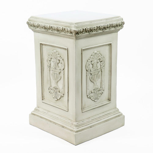 Classical European statue of a robed woman on an ornate pedestal with Renaissance and Baroque decorative reliefs. Different Angle