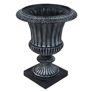Ornate classical urn planter with fluted body, decorative rim, and pedestal base in old world European style. Side View
