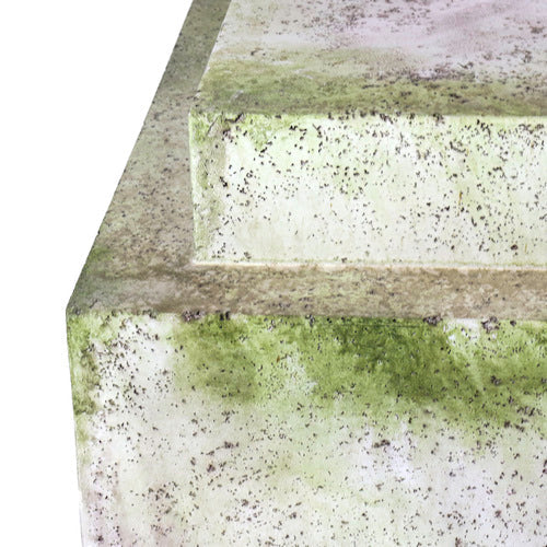 Stacked square pedestals with weathered, old world European style and ornate, classical detailing, featuring a mossy aged finish. Different Angle