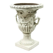 Ornate urn planter with classical Baroque detailing, acanthus leaf motifs, and scroll handles on a pedestal base. Side View